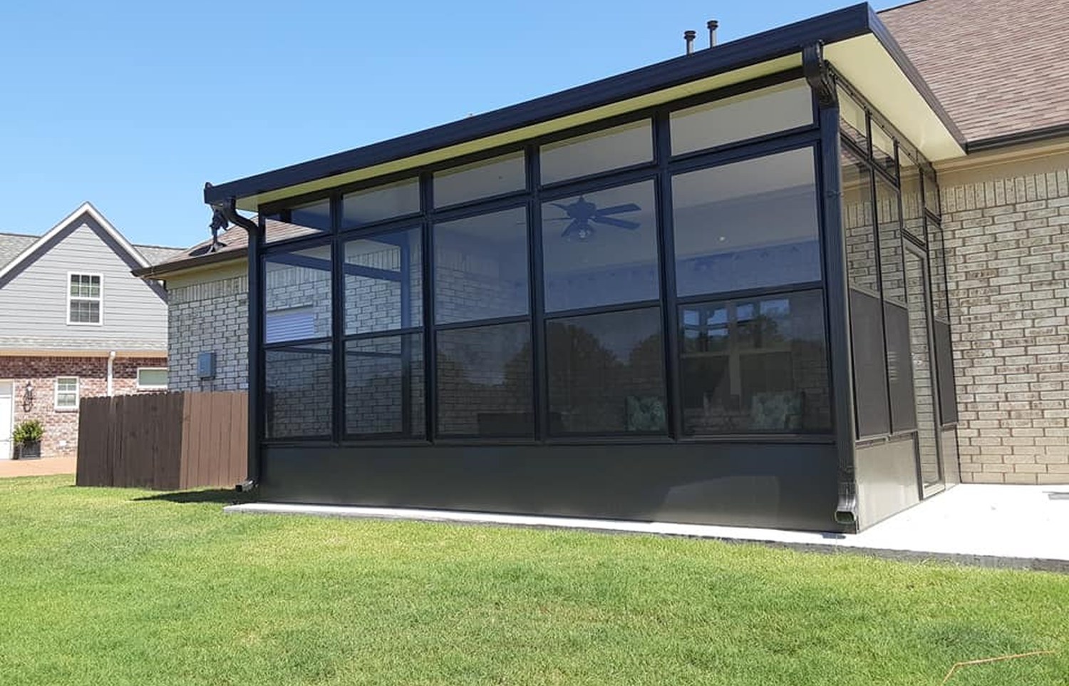 Metro Awnings patio room with dark aluminium frames